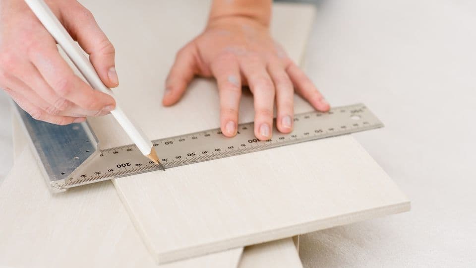 Home improvement - handywoman measuring tile