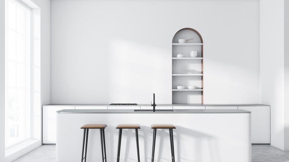 Interior of modern kitchen with white walls, concrete floor, arched cupboard, white countertops with built in cooker and white bar with stools. 3d rendering
