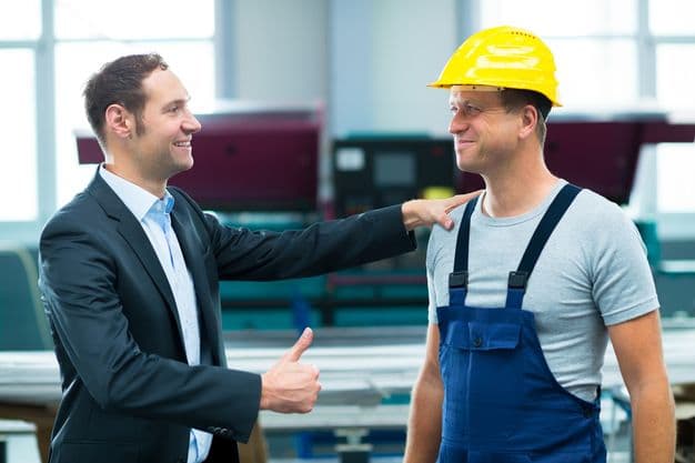 young boss is lauding worker in factory