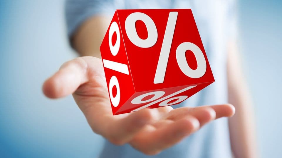 Businessman on blurred background using white and red sales flying icons 3D rendering