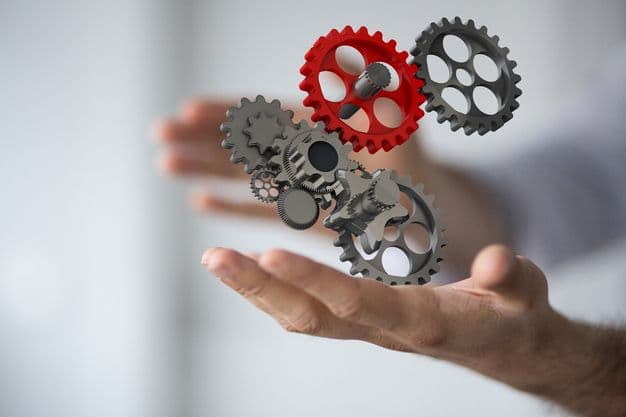 Zahnräder stehen auf einer Hand - system