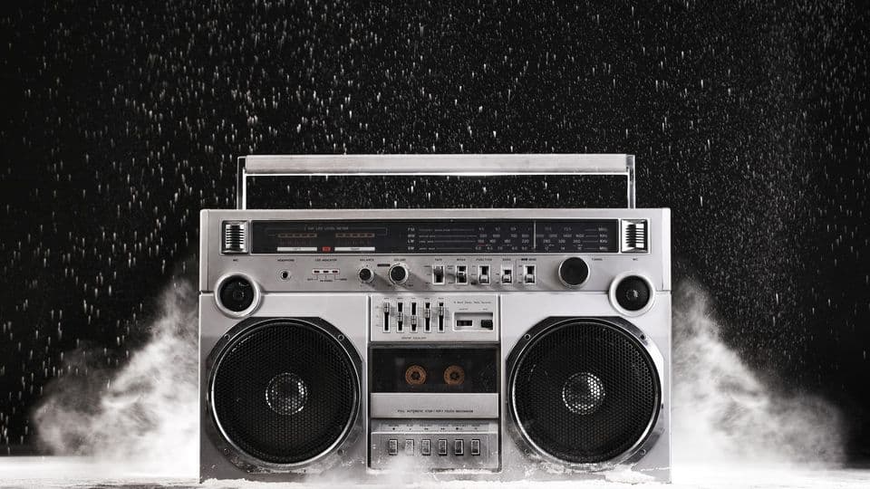1980s Silver Retro ghetto blaster and dust isolated on black background with clipping path