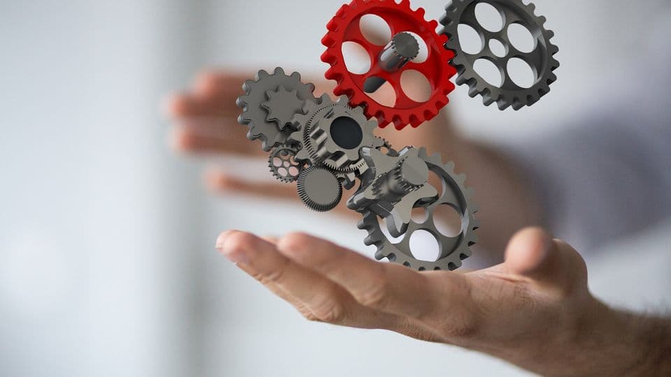 Zahnräder stehen auf einer Hand - system